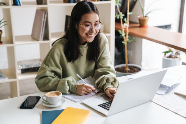 Image of student on her laptop